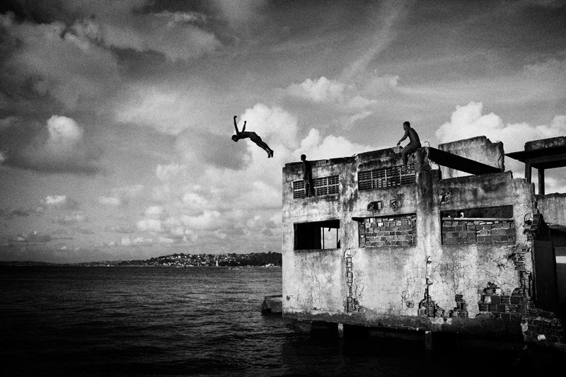 Sebastian Liste - A boy jumping from a building of the abandoned chocolate factory, 2011 in Salvador de Bahia, Brazil