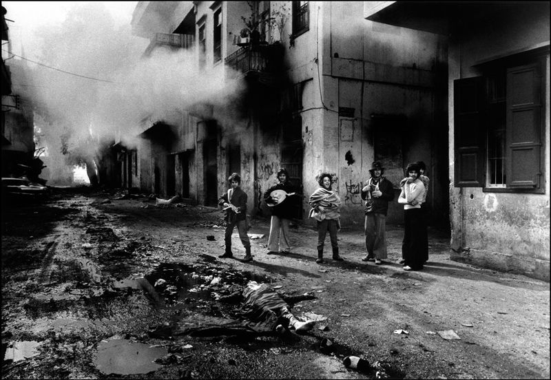 Don McCullin - Christian millitia men beside the body of a teenage Palestinian girl, Beirut 1976