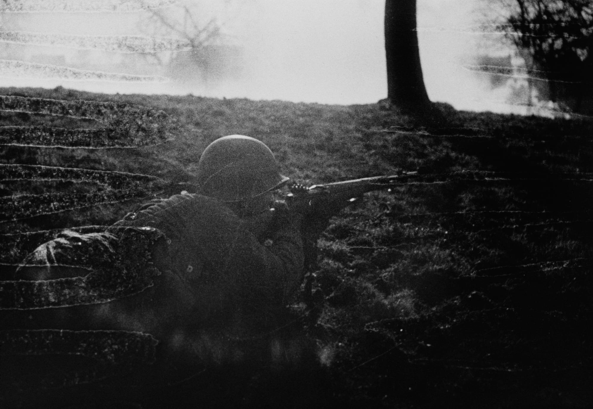 Tony Vaccaro - An American GI lines up a shot during the battle on the Rhineland Valley 1945