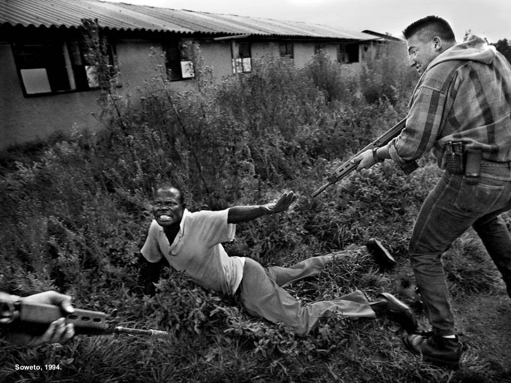 David Turnley - South African police arrest a Zulu man suspected of being a sniper, Soweto, South Africa 1994