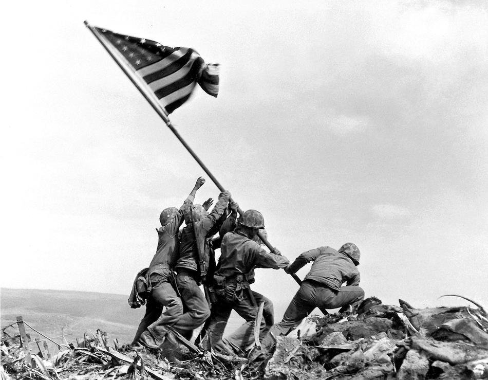 Joe Rosenthal - US Marines of the 28th Regiment of the Fifth Division raise the American flag atop Mt. Suribachi, Iwo Jima 1945