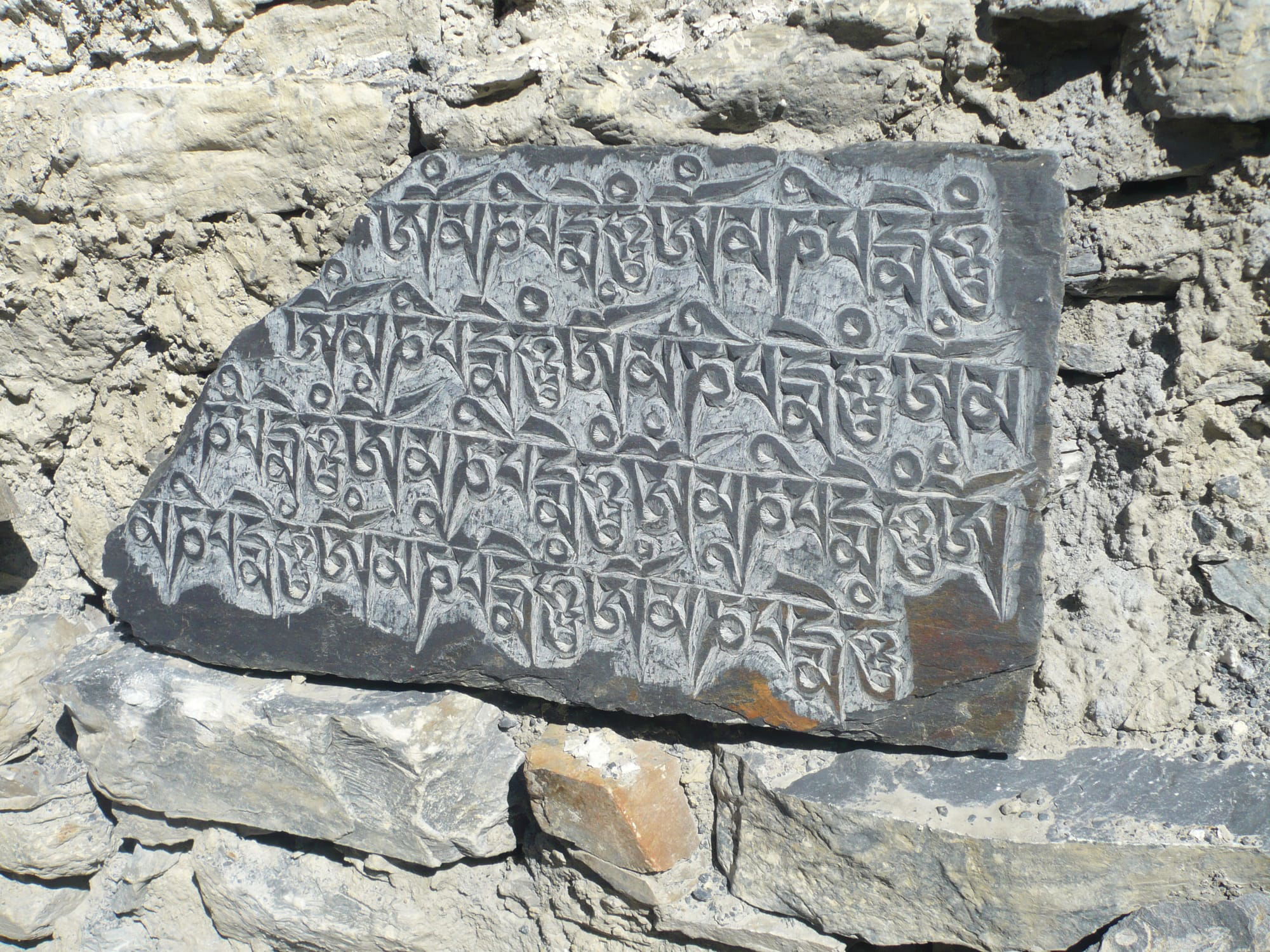 A MANI CARVED PRAYER WALL