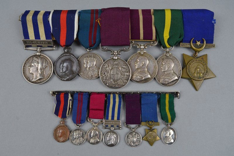 FEGAN, Daniel, Regimental Sergeant Major. Image of medals worn by RSM Fegan with a set of miniatures: the 1902 and 1911 Coronation medals; Egypt medal with ‘Tel-el-Kebir’ bar, Khedives Star; Army Long Service and Good Conduct medal; Army Meritorious Service Medal and the Territorial Force Efficiency medal (Reproduced courtesy of Richard Winterton Auctioneers Ltd, UK).
