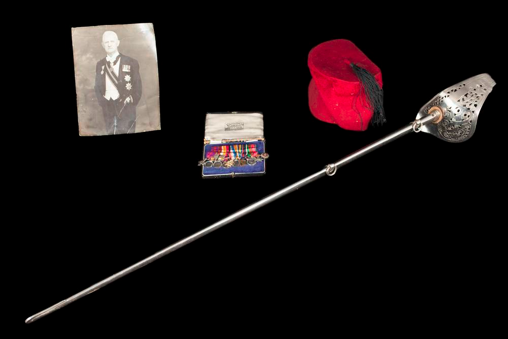 Officers fez & a photograph of Kaïd Andrew Belton in official mess uniform plus the full-size medal The Order of Medjidieh and 1897 Wilkinson presentation sword.