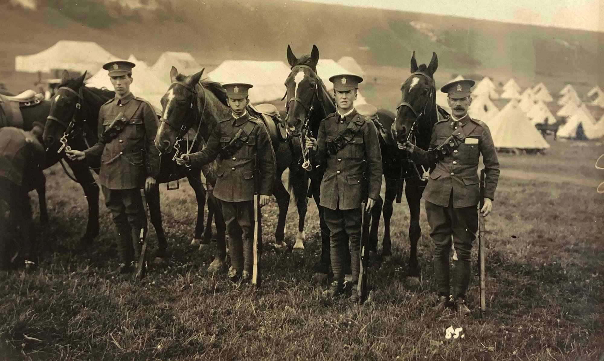Serjeant Sid Bromfield and four Other Ranks of King Edward’s Horse in Service Dress circa 1913. They are equipped with 1903 pattern, Mounted Infantry leather 50 round .303 bandoliers and are wearing King Edward’s Horse headdress badges. Serjeant Bromfield is wearing ‘B’ Squadron (British American) collar badges which as noted above denotes his proud service in the former King’s Colonials.