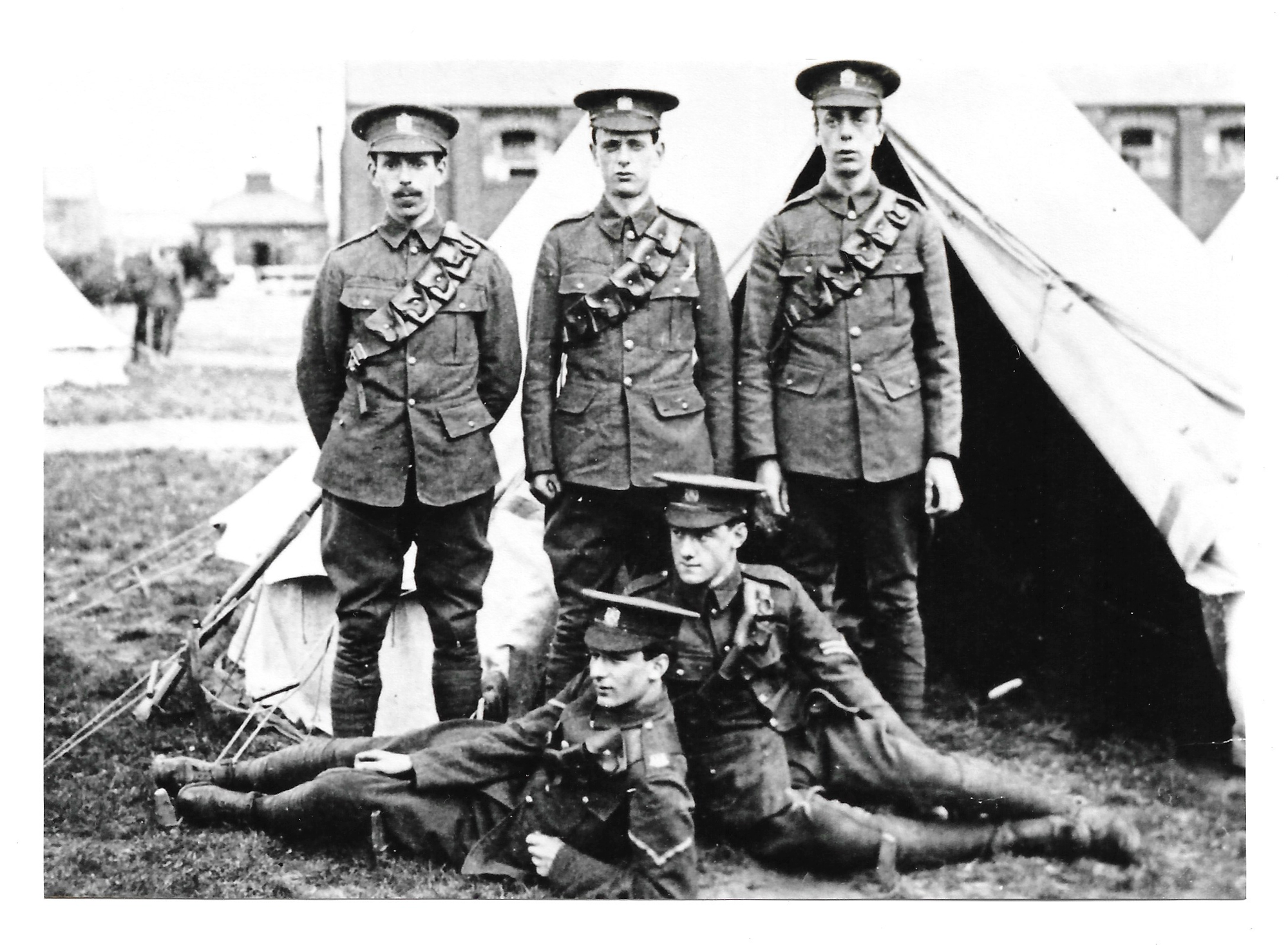 Five KEH men at camp - young looking recruits with a Lance Corporal and Corporal. KEH cap badges and KEH KODR shoulder titles visible.