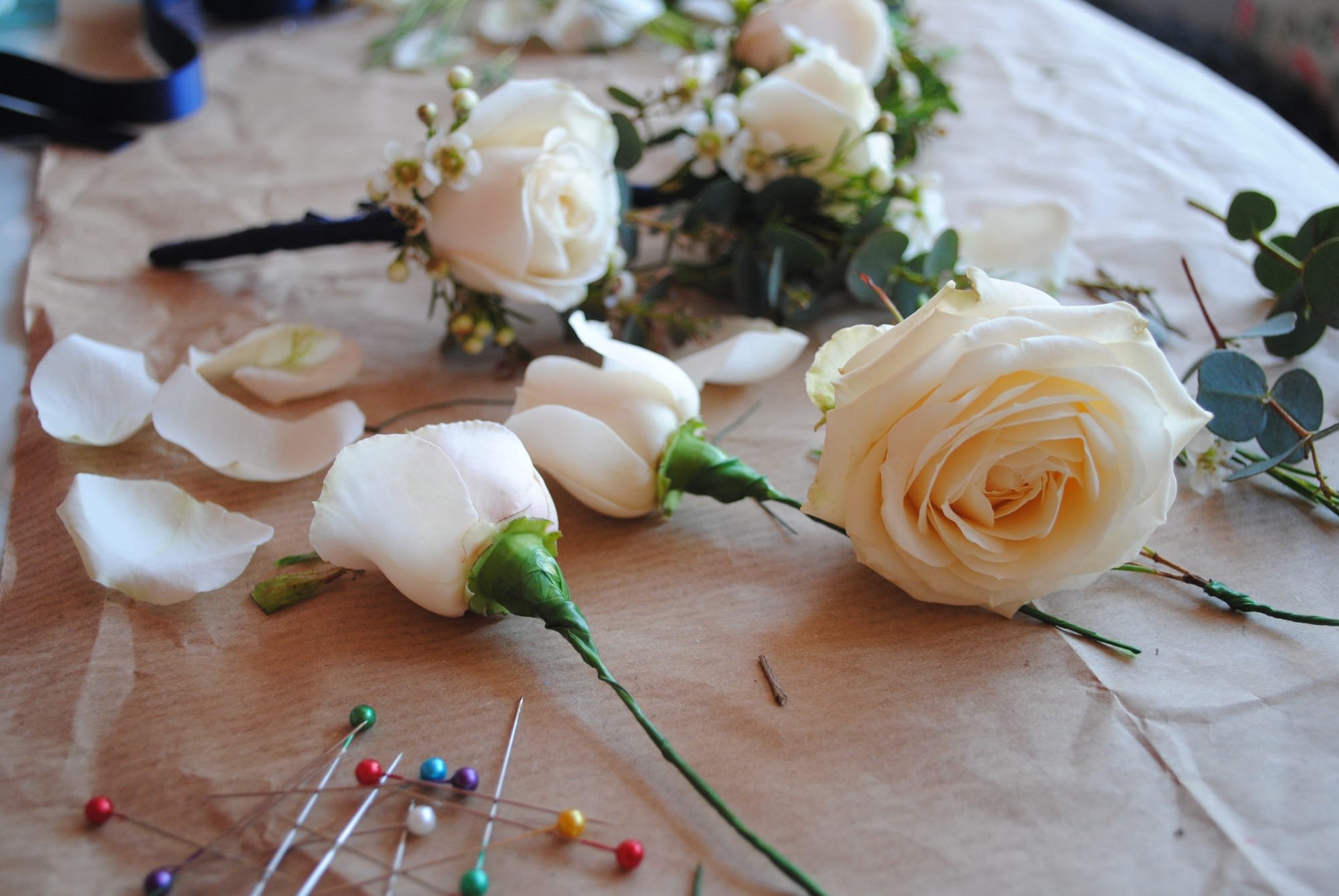 Rose buttonholes in progress.