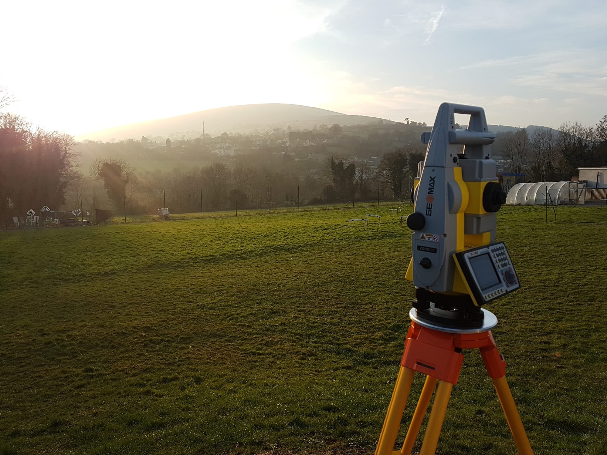 Sun setting on a topographical survey