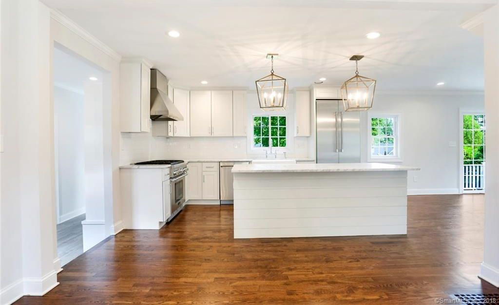 White Shaker Cabinets with White carrara countertop