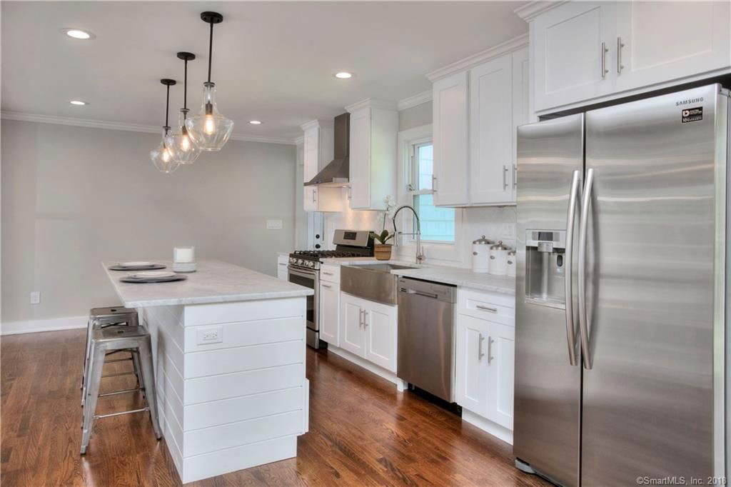 White Shaker Cabinets with White carrara countertop