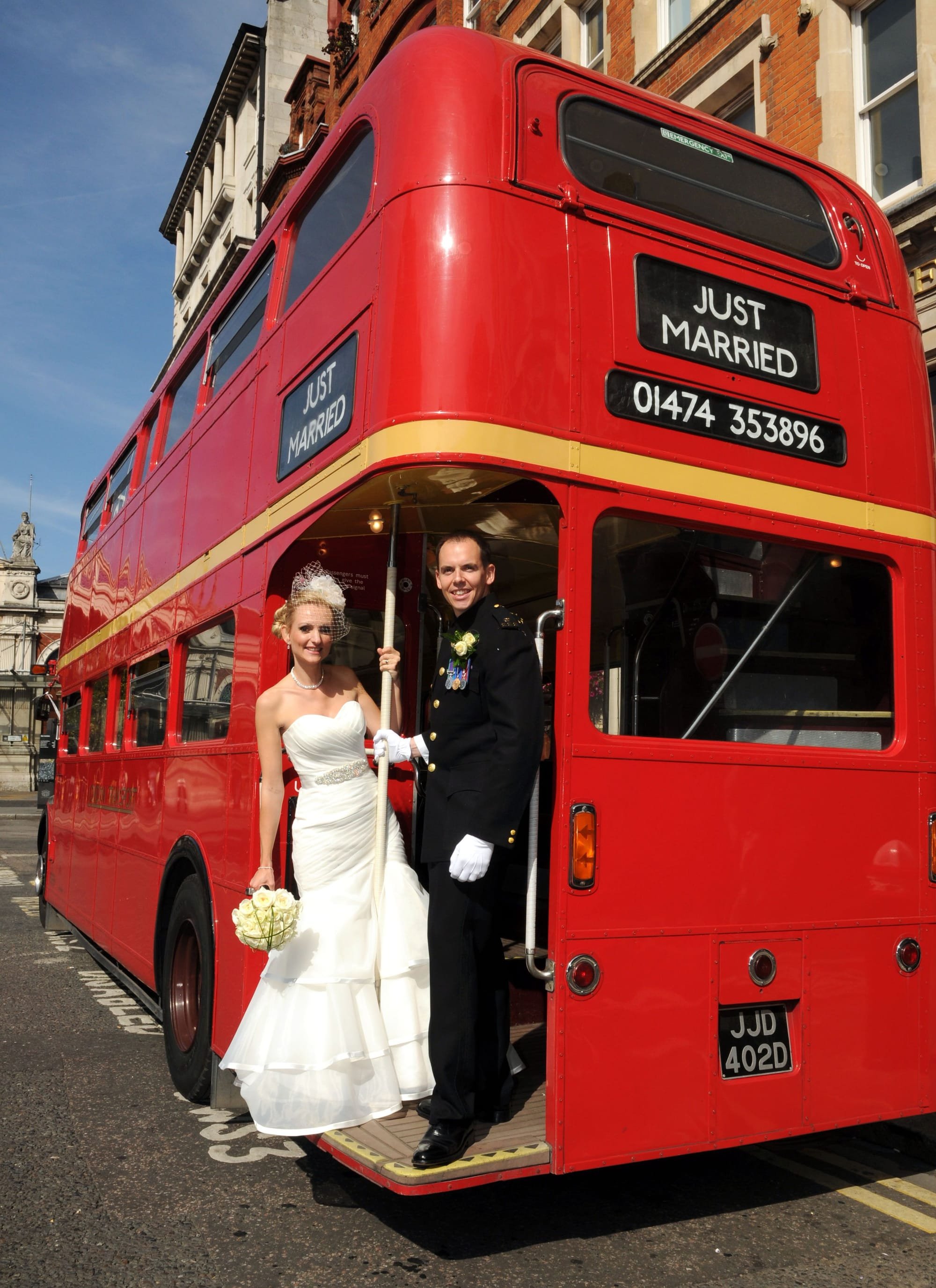 Married Couple with Wedding Bus