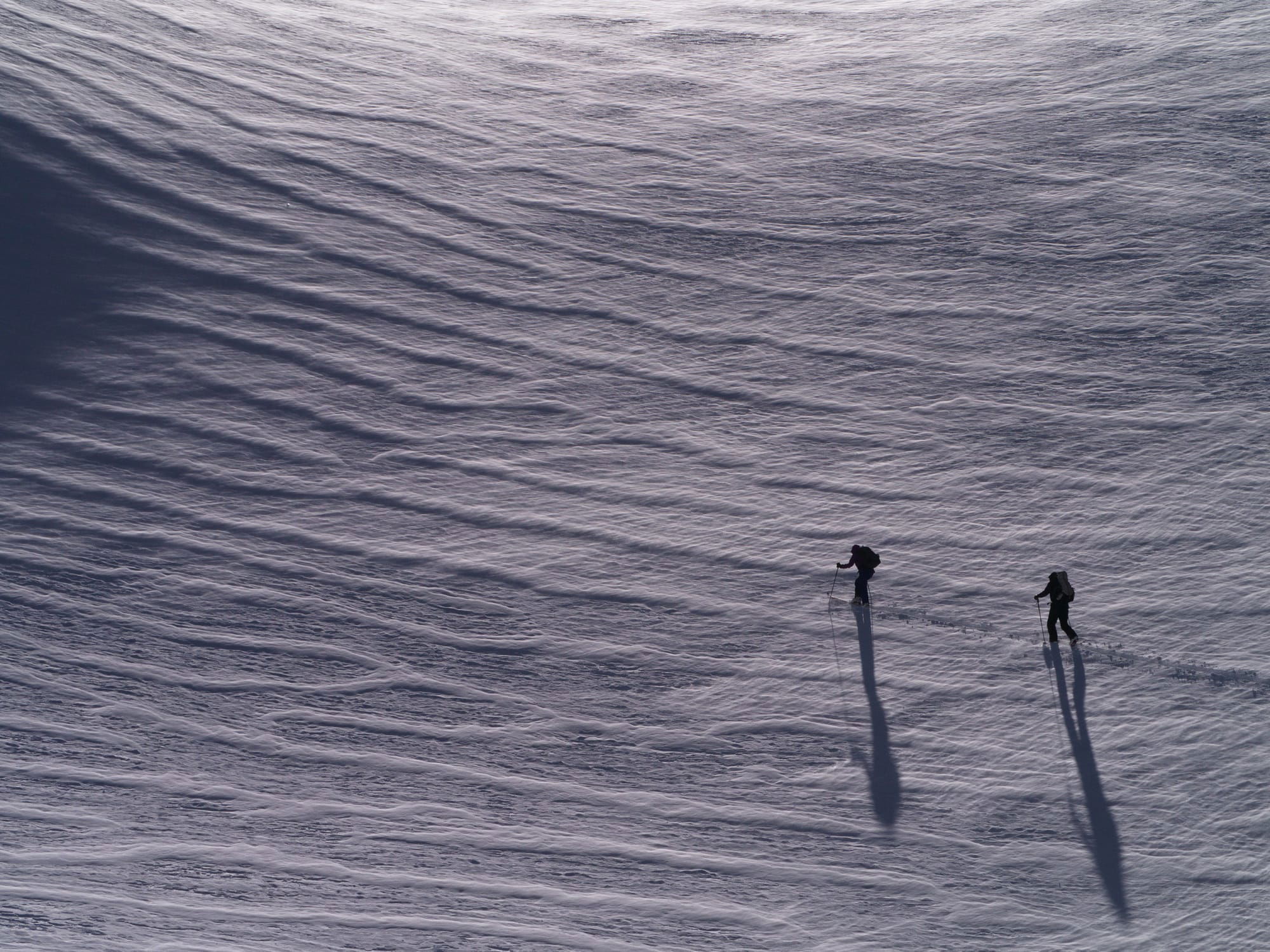 Skinning up wind textured snow towards Cerro Mohai