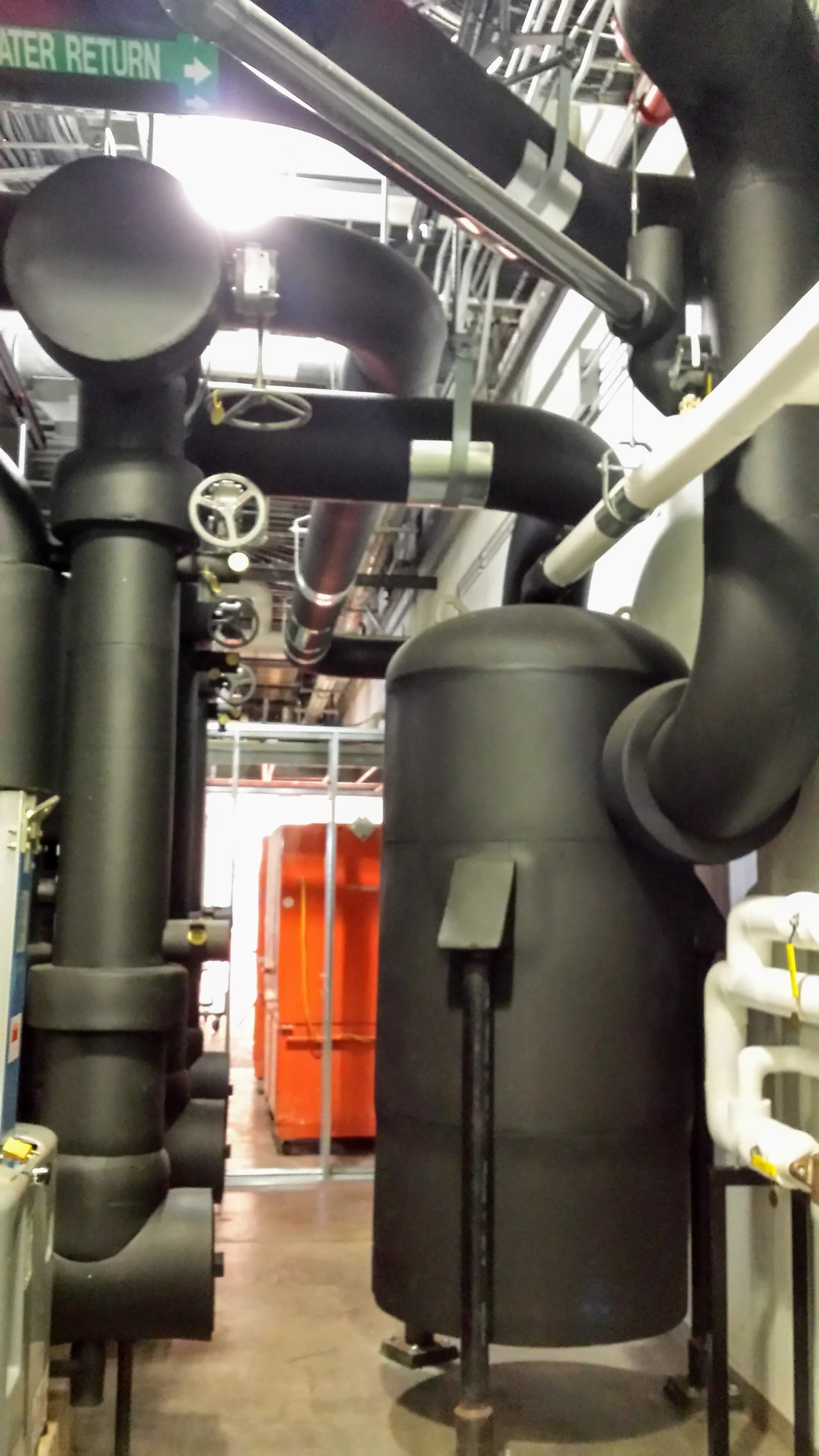 Elastomeric Closed-Cell Rubber Insulation over Chilled Water Piping, Pumps and Tanks