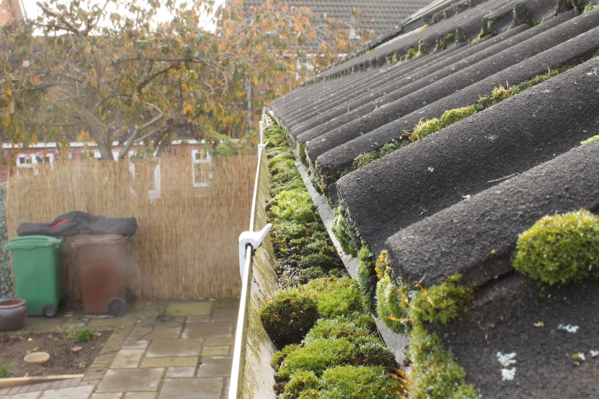 Cleaning gutters removing blockages