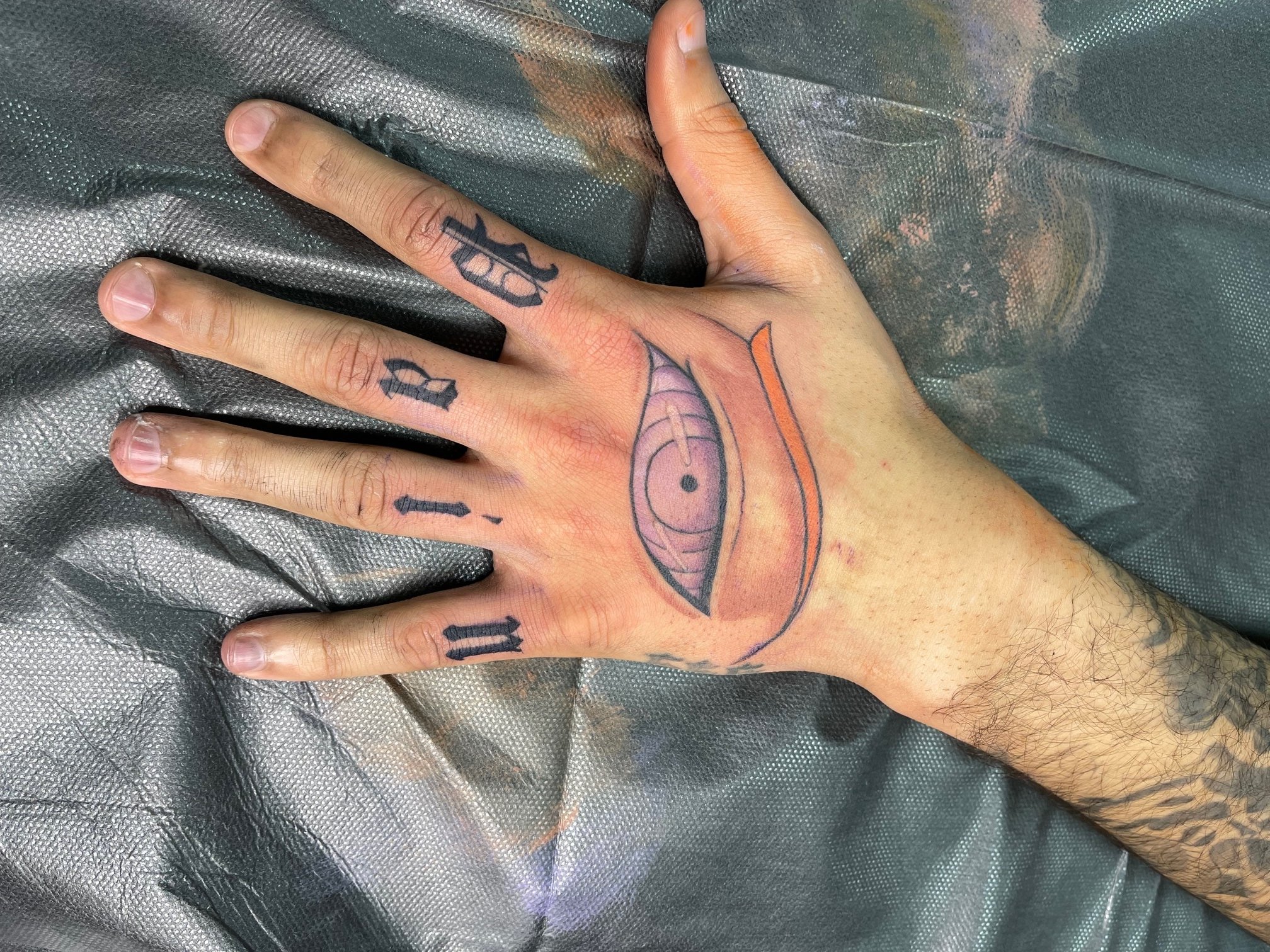 Pain Hand Tattoo