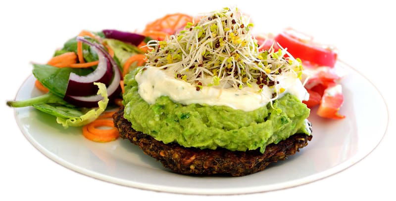 Canape "Miracle burger" with pea guacamole, almond mayonnaise and broccoli sprouts.