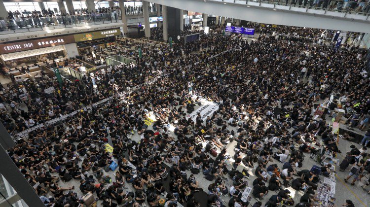 Flights out of Hong Kong airport cancelled as mass protest gathers steam