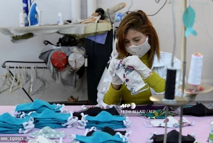 ALKALEEJSAOUDIA : Tunisian seamstresses make designer protective masks at the workshop of the Miss Anais