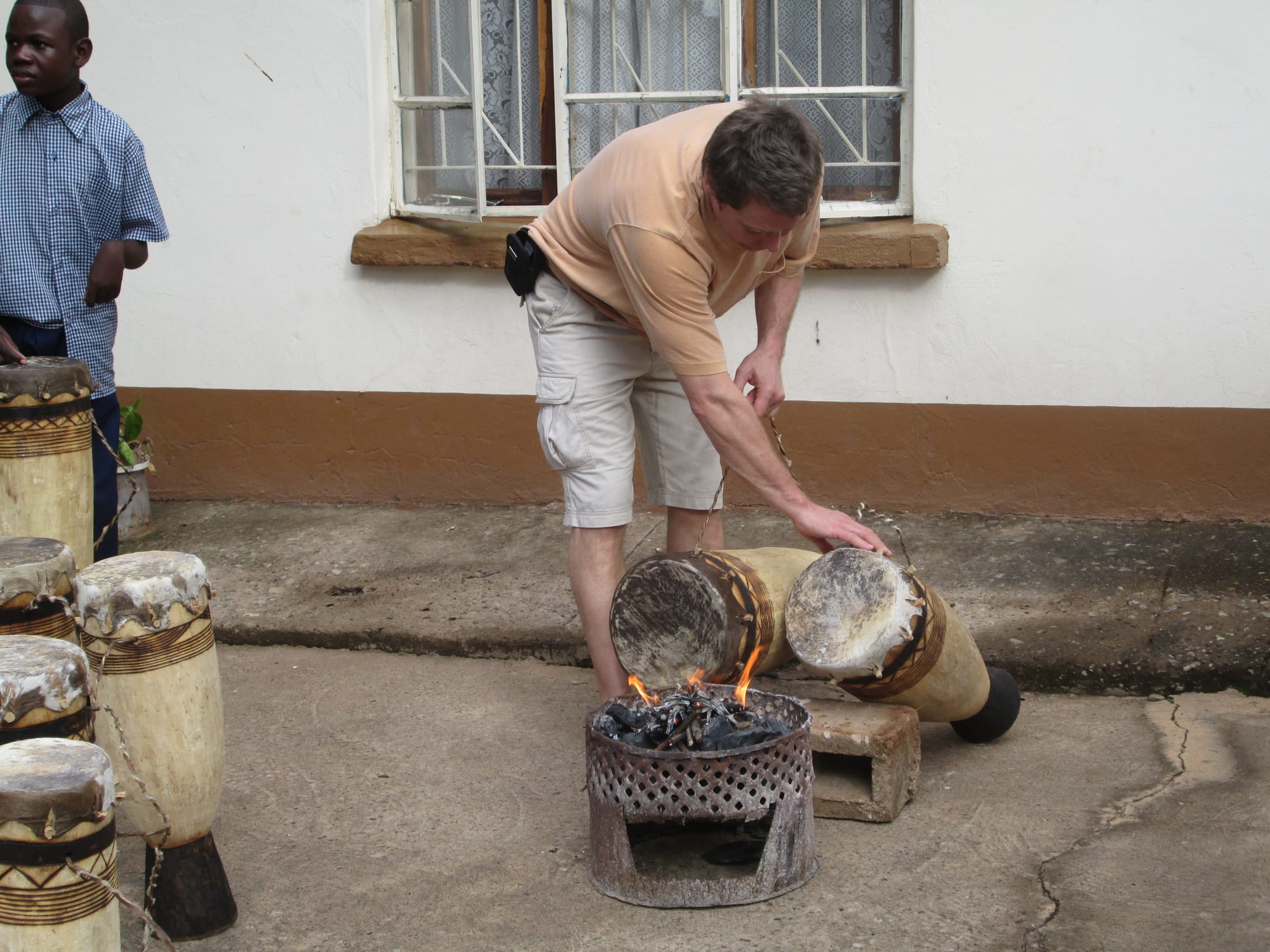 Tuning the drums with fire.  Early morning, Livingston, Zambia.