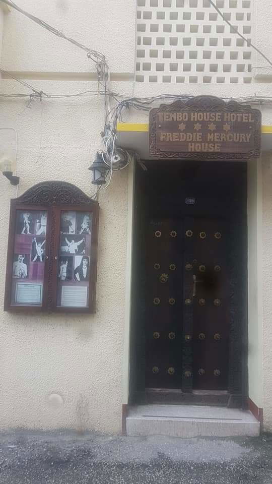 Standing at the door of Freddie Mercury's home in Stonetown, Zanzibar