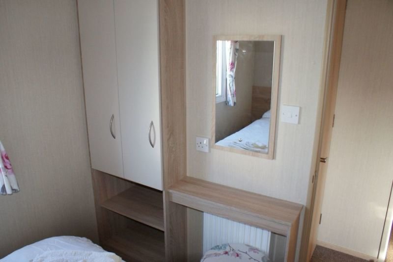Main Bedroom With Wardrobes And Dressing  Area With Stool