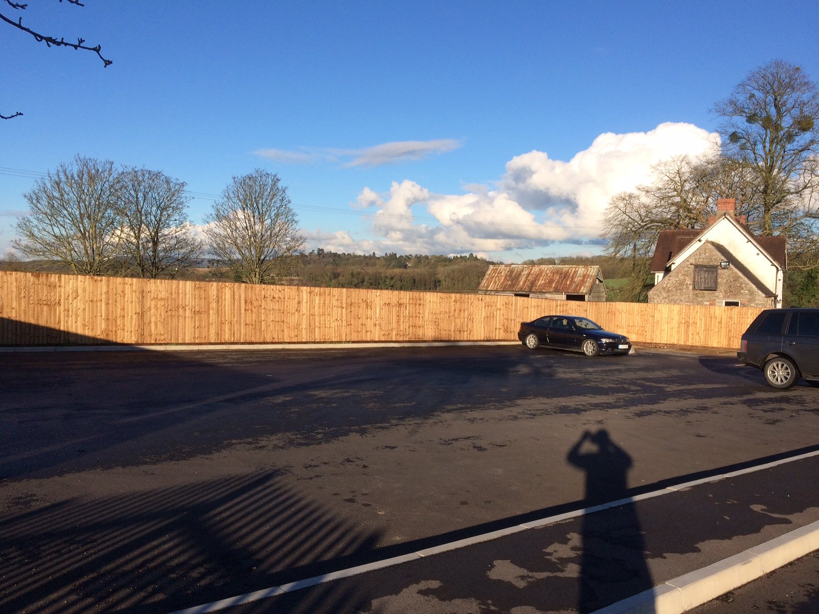 Feather edge fencing to hotel car park