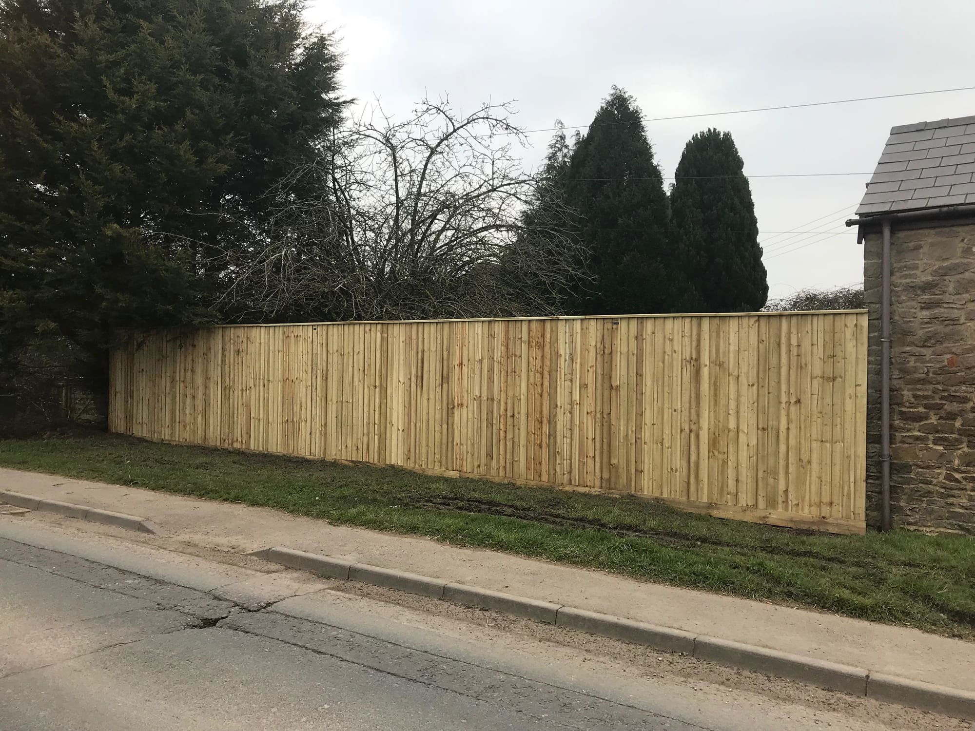 Feather edge fencing with C cap -2.1 metres high and 15 metres long in Gloucestershire