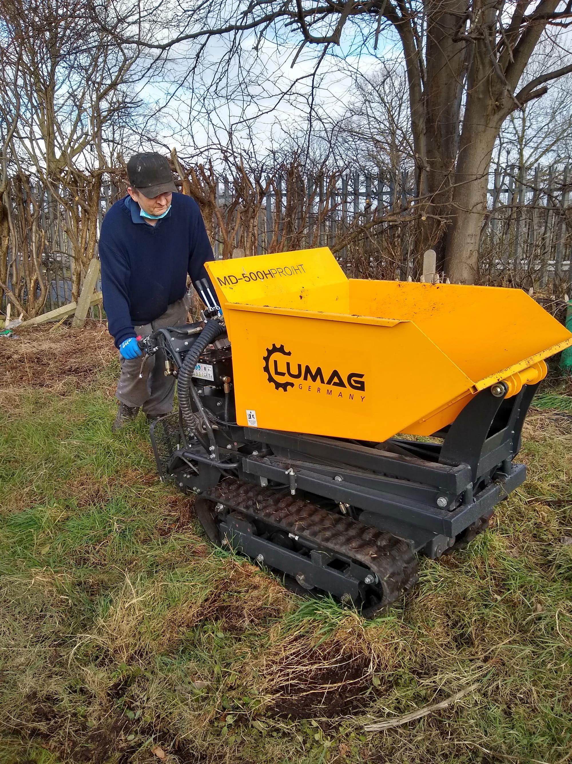 The Lumag motorised barrow dumper moving soil at an allotment