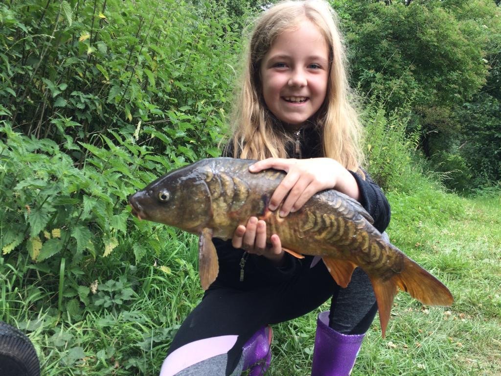 Kaylee with her Mirror Carp from Pond House