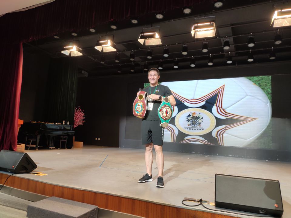 Jayden (Qupeng) giving an inspirational speech to the kids in Songjiang at their annual prize giving