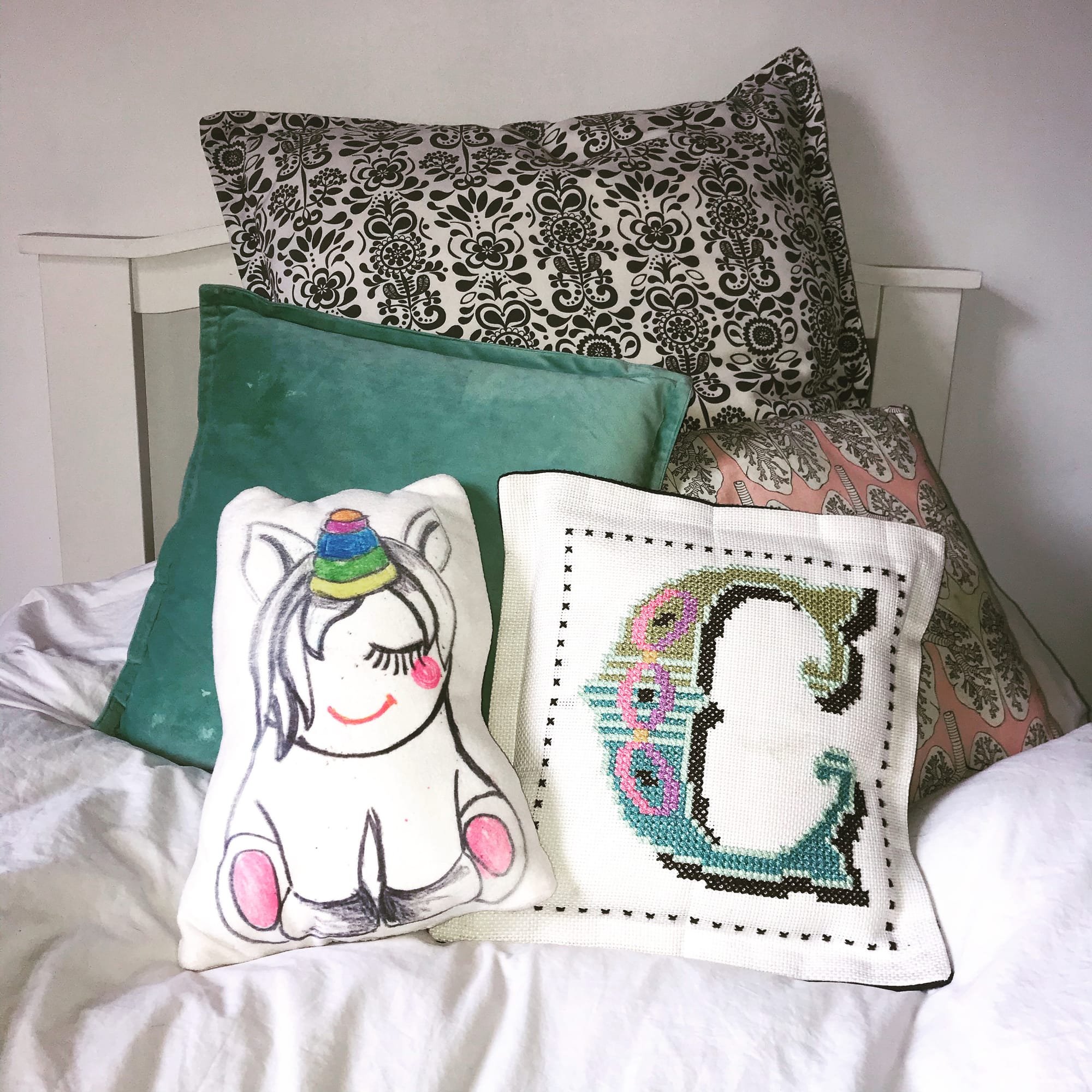 Unicorn cushion & Cross Stitch cushion