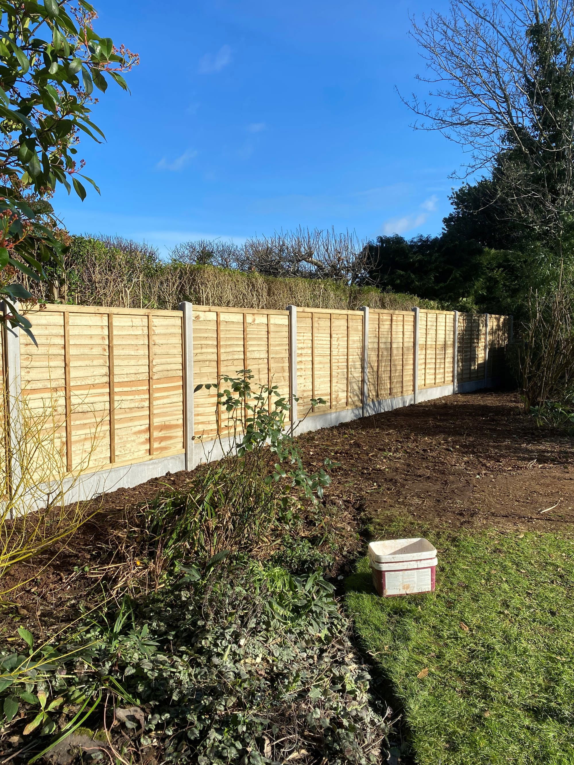 Featheredge Fence Panels with Concrete Posts and Gravel Boards