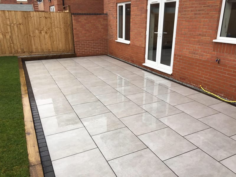 Newstone Grey Porcelain - Lazura - edged with Impala Black Setts ...