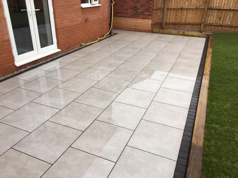 Newstone Grey Porcelain - Lazura - edged with Impala Black Setts ...