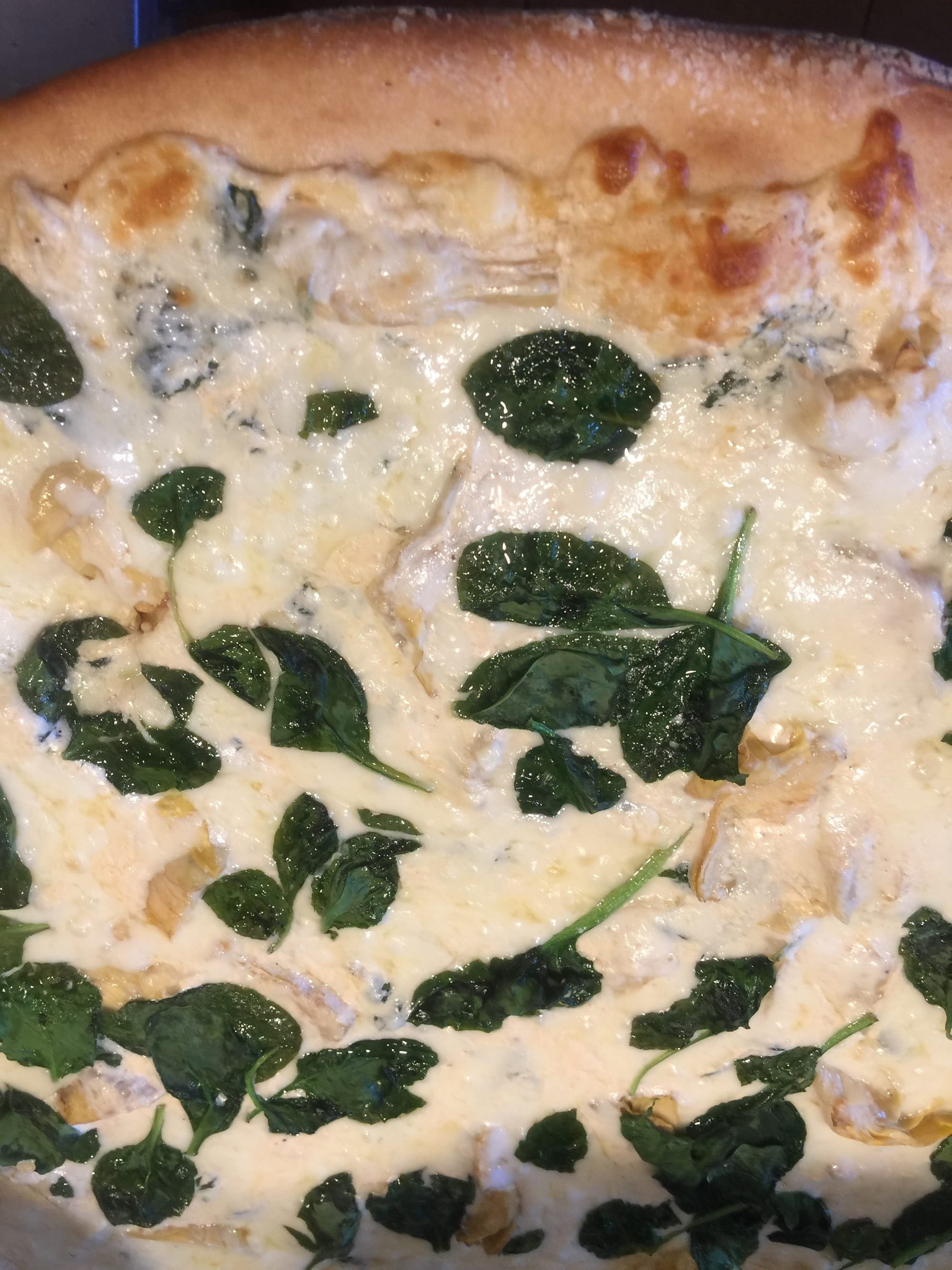 Creamy spinach and artichoke pizza