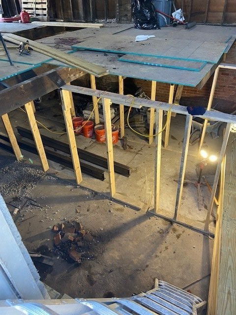 1st floor view - looking down at cleaned out basement