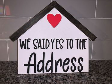 Small "We said yes to the address" sign