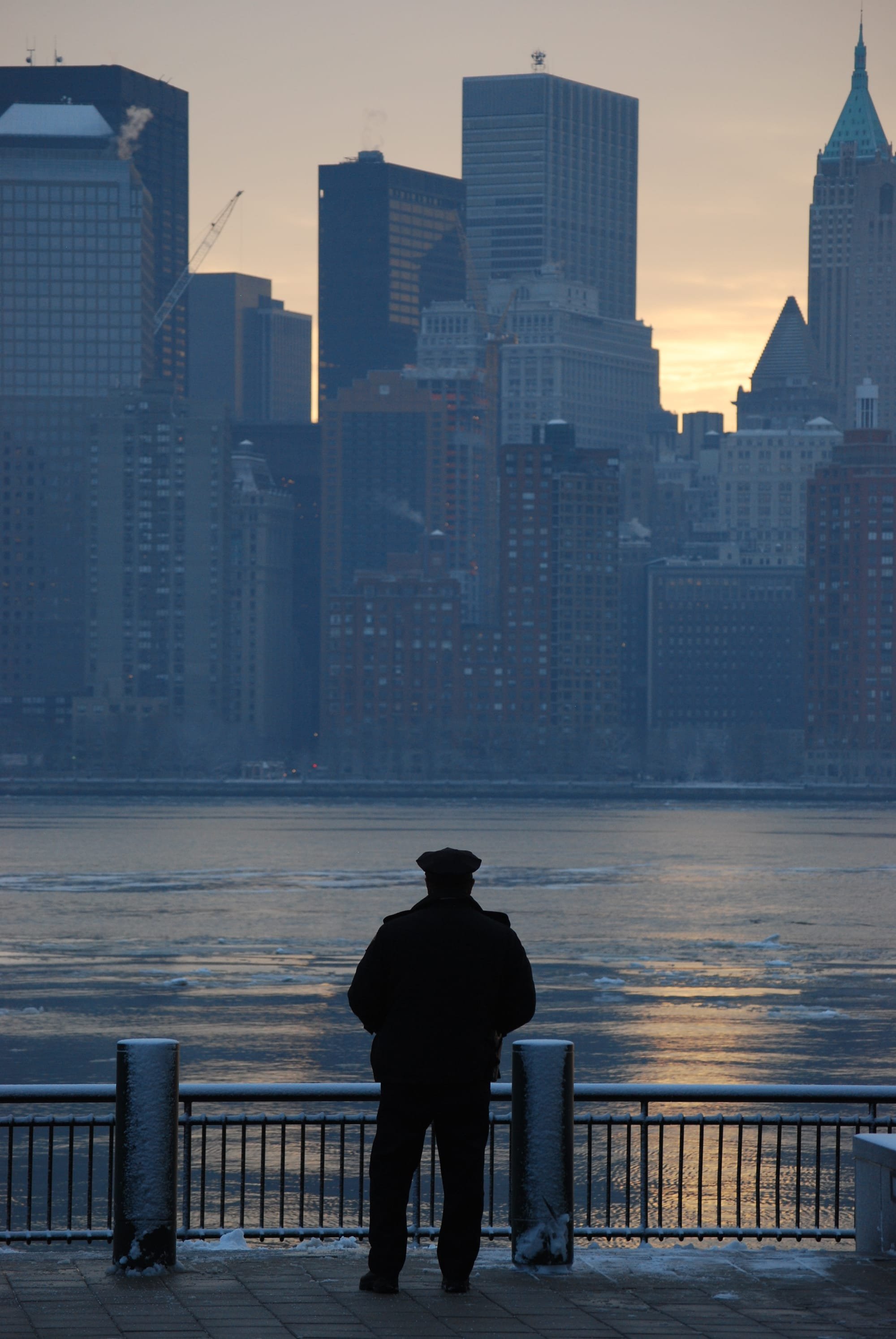 227. Officer looking at lower Manhattan a cold Winterday