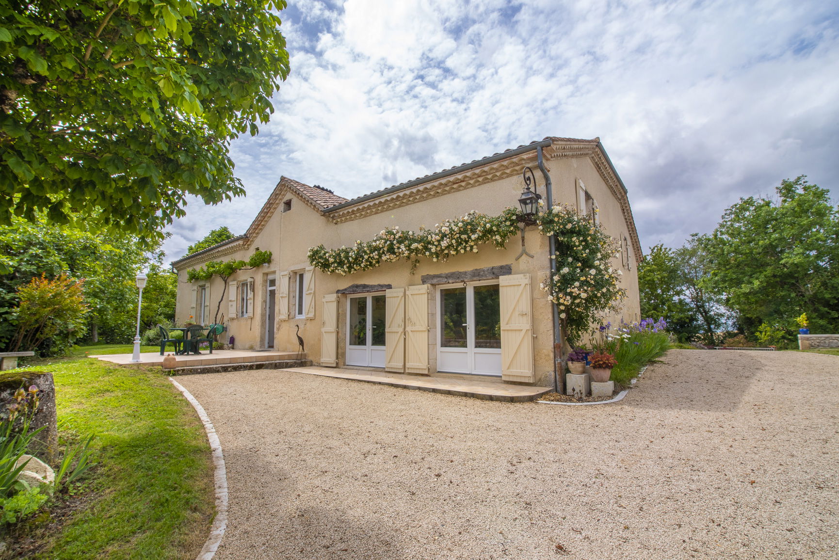 Outbuildings with cozy limestone house