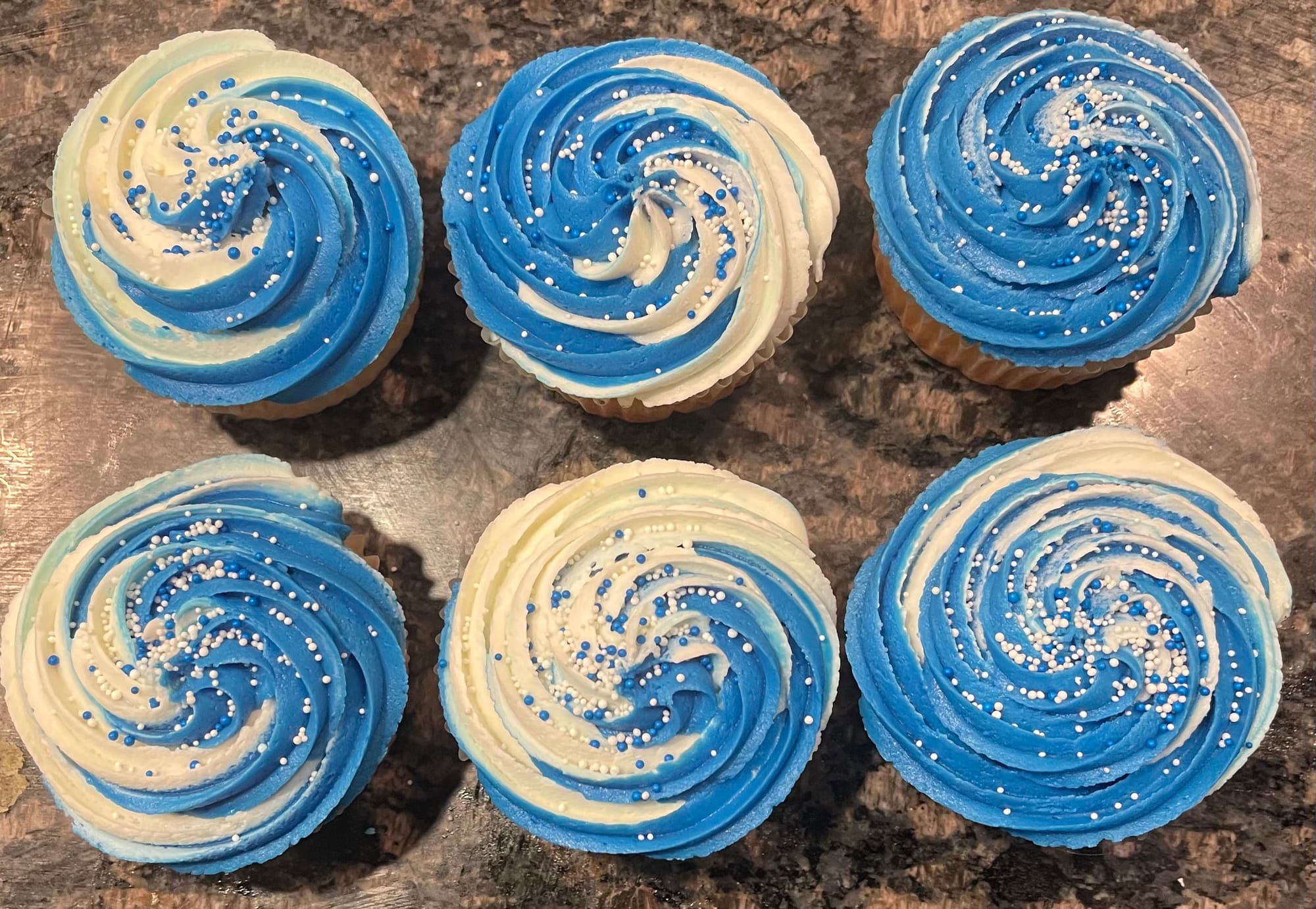 Vanilla Cupcakes With Blue And White Swirl Buttercream Frosting