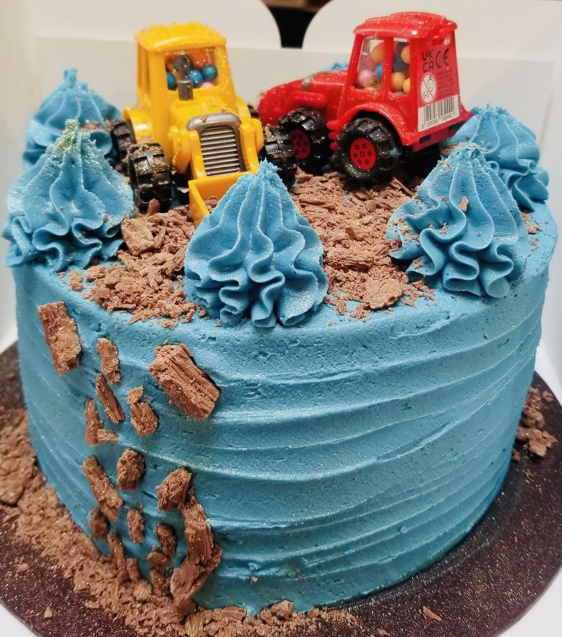 2 Layer Chocolate and Vanilla Construction Vehicles Cake with Buttercream Frosting