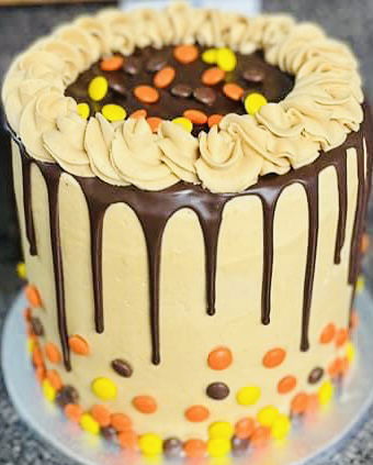 4 Layer Chocolate and Peanut Butter Reese’s Pieces Cake with Peanut Butter Frosting and Candy