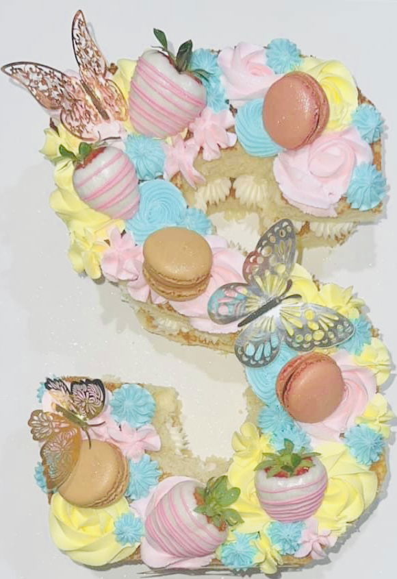 Letter S Vanilla Cake with Buttercream Frosting, Chocolate Dipped Strawberries, and Macarons