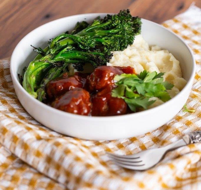 Chutney meatballs with charred Tenderstem® broccoli and creamy mash