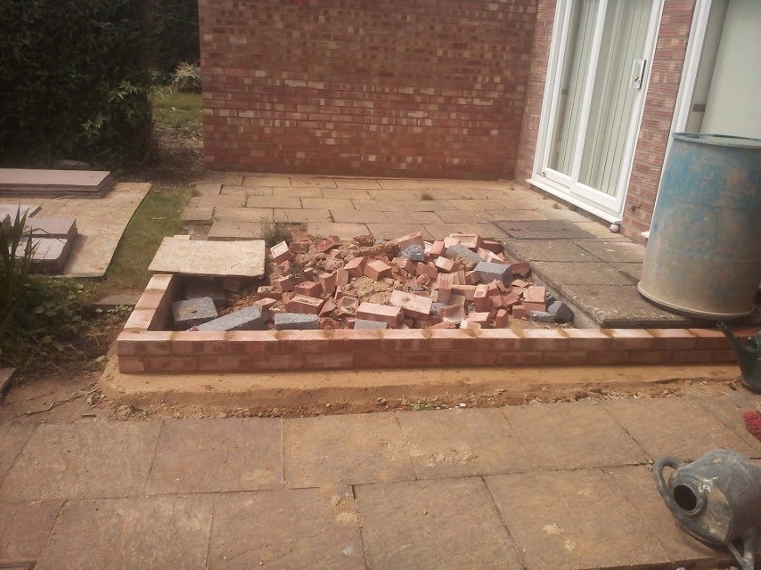 Oundle - Patio before.....