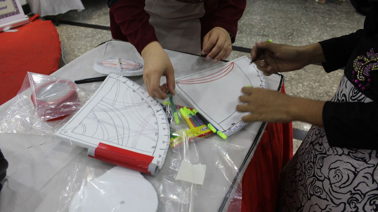 Kids at the Workshop corner learning to make an old time Geographical Astrolabe