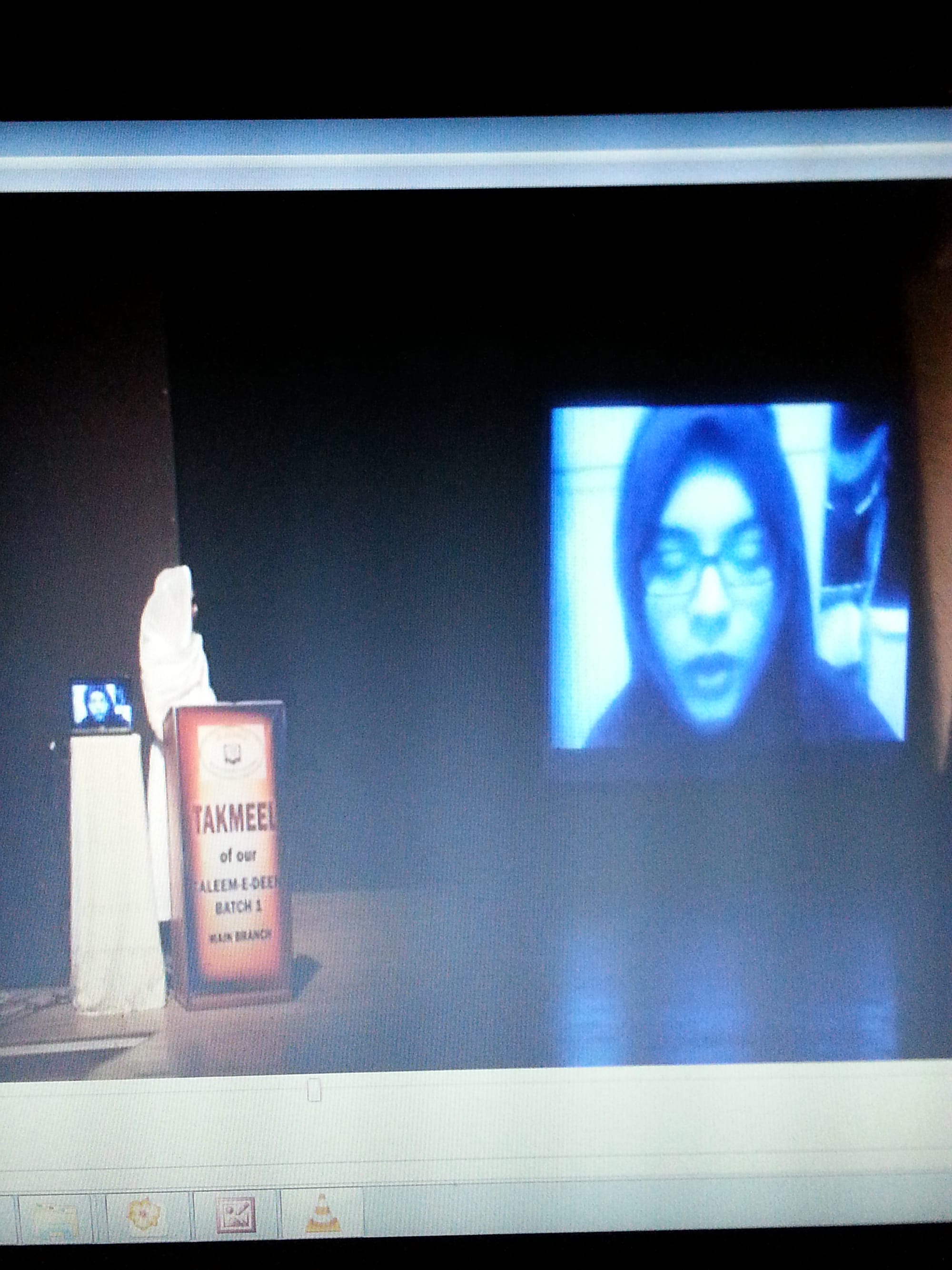 Ustaza Nada addressing the students and audience via Skype