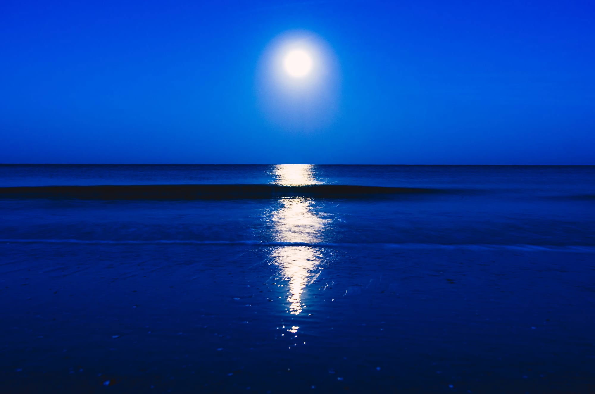 SUNRISE OVER QUIET BLUE OCEAN IN MARCO ISLAND, FL