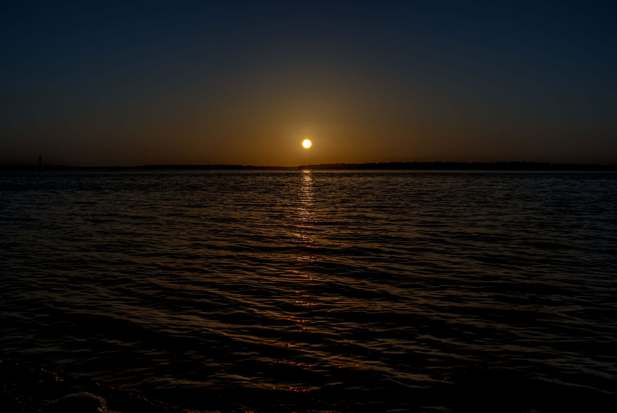 SUNRISE OVER QUIET BLUE OCEAN IN MARCO ISLAND, FL