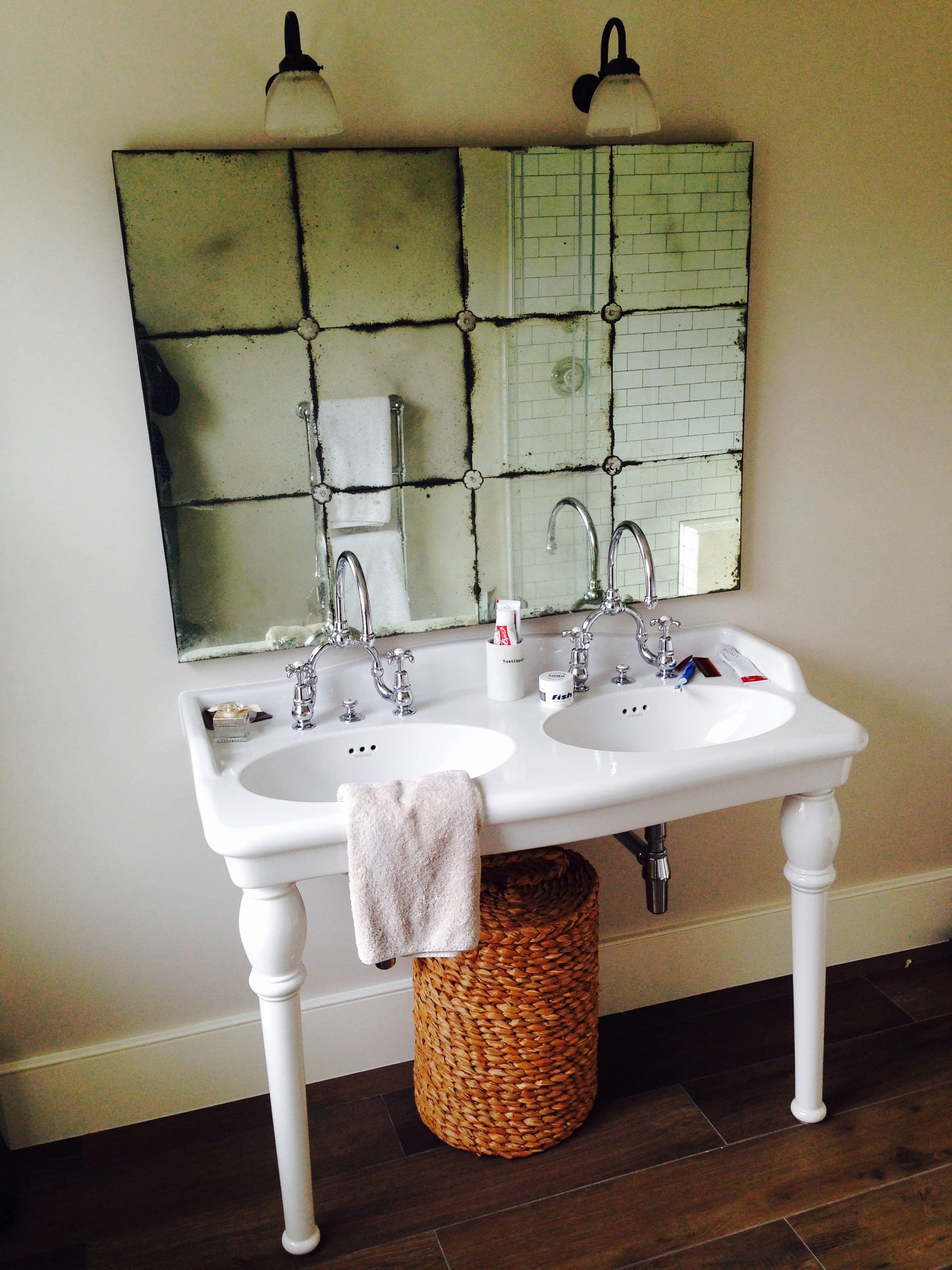 Double sinks and antique mirror to new en-suite bathroom in Wandsworth house refurbishment.